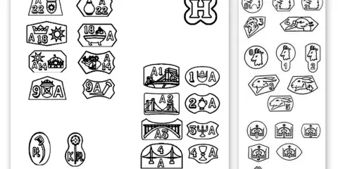 Kolekcja znaków probierczych, w tym próby platyny oznaczenia, przedstawiająca różne symbole i cyfry.